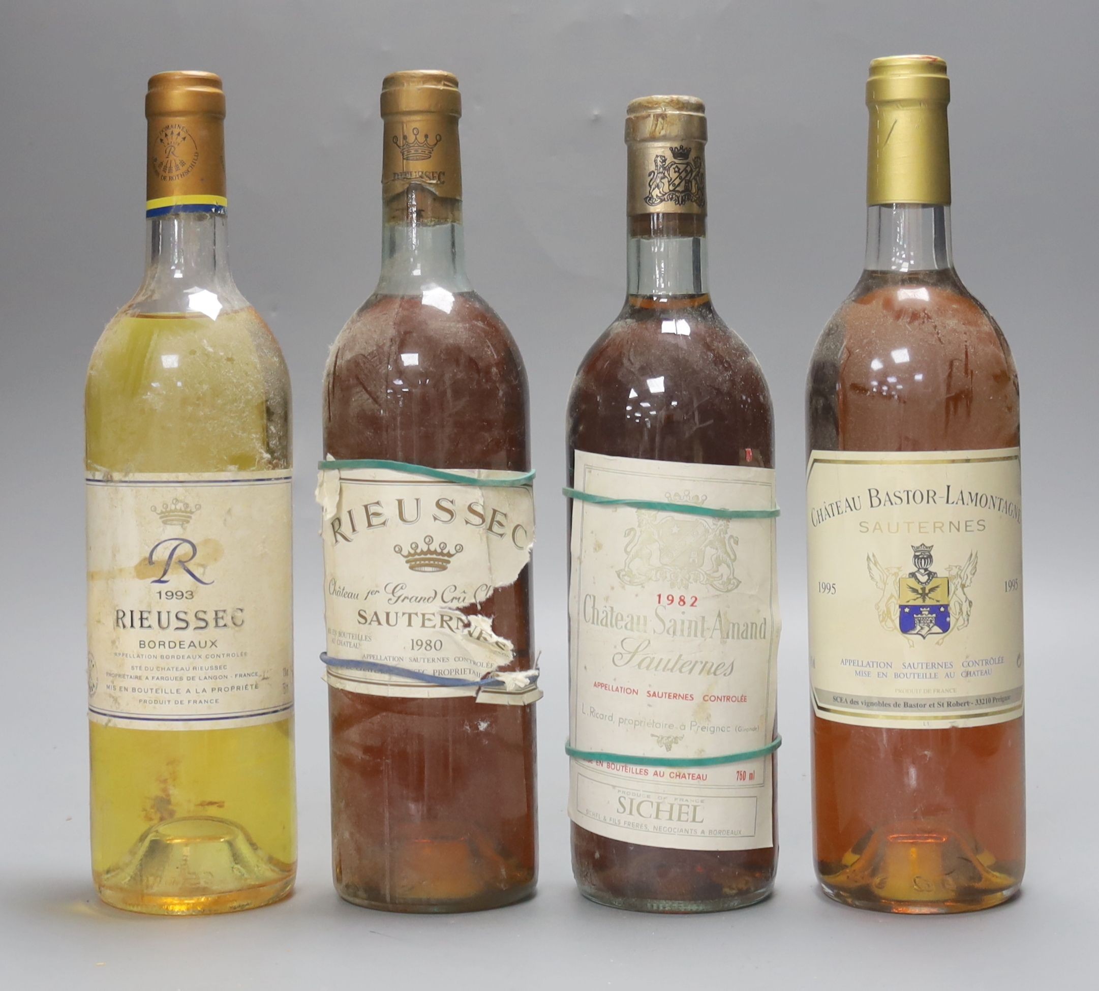 Four assorted white wines including Saint Amand, 1982, Rieussec, 1980 & 1993 and Bastor Lamontagne, 1995.